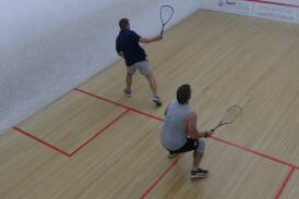 Jason Curry plays a backhand shot with Brent Lister ready to make the return. Picture supplied