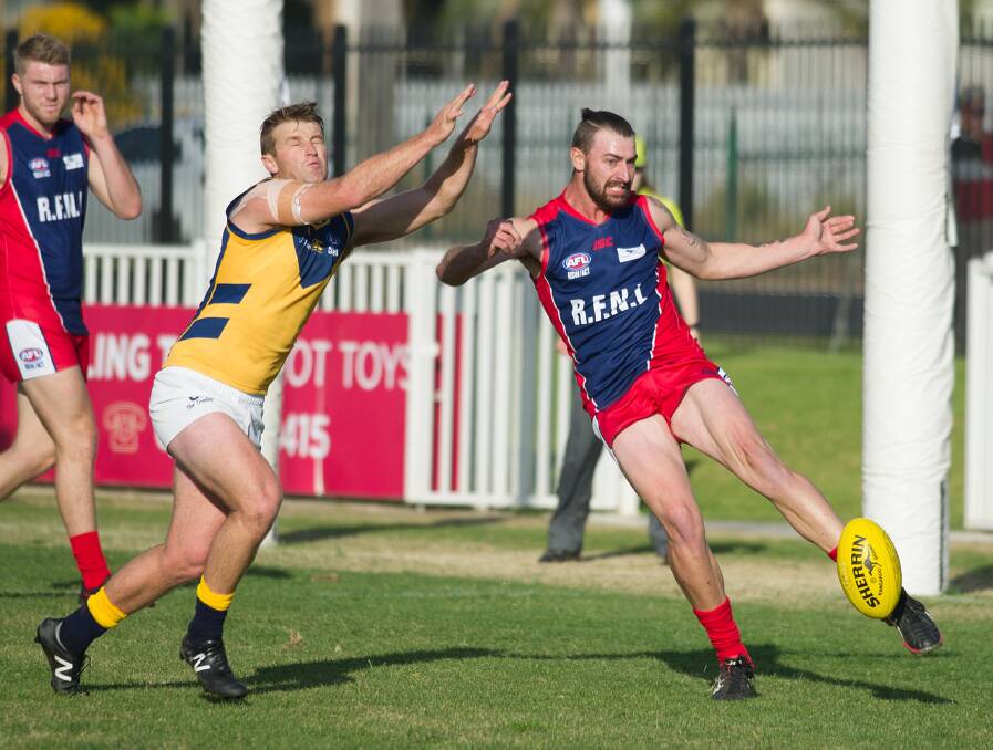 Josh Ashcroft gets a kick away during the Riverina League's representative clash against AFL Canberra in 2017. There are calls for the concept to return to the calendar after a five-year hiatus.