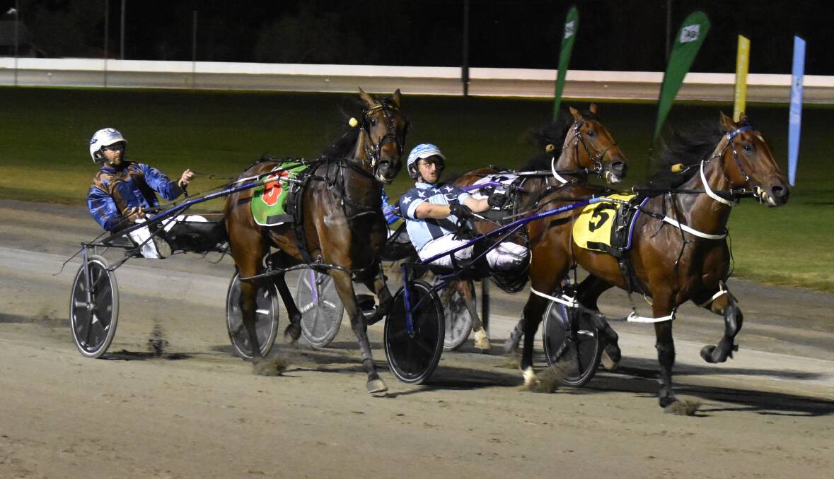 Romanee holds off Western Style and Sportingjoy to win the Leeton Pacers Cup on Sunday night. Picture by Courtney Rees