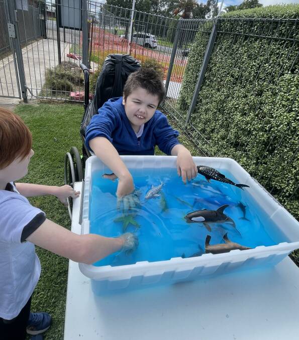 Mason Craker enjoys one of the sensory tubs that were part of the day's fun and imagination. Picture supplied