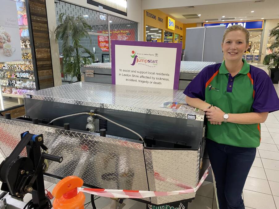 Leeton JumpStart Fund co-ordinator Lisa Harrison with the impressive camper trailer package, which is being raffled off in aid of the organisation. Picture by Talia Pattison