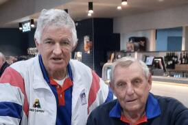 Leeton Soldiers Club bowlers Greg Caffery (left) and Dennis Dean celebrate their win. Picture supplied
