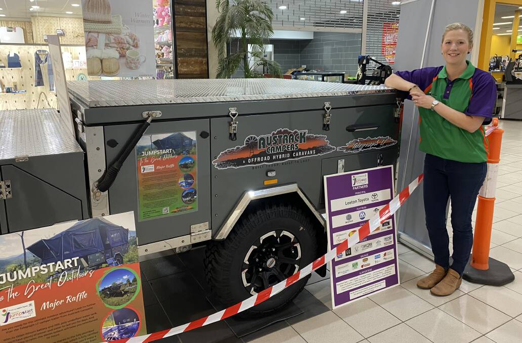 Leeton JumpStart Fund co-ordinator Lisa Harrison with the impressive camper trailer package, which is being raffled off in aid of the organisation. Picture by Talia Pattison