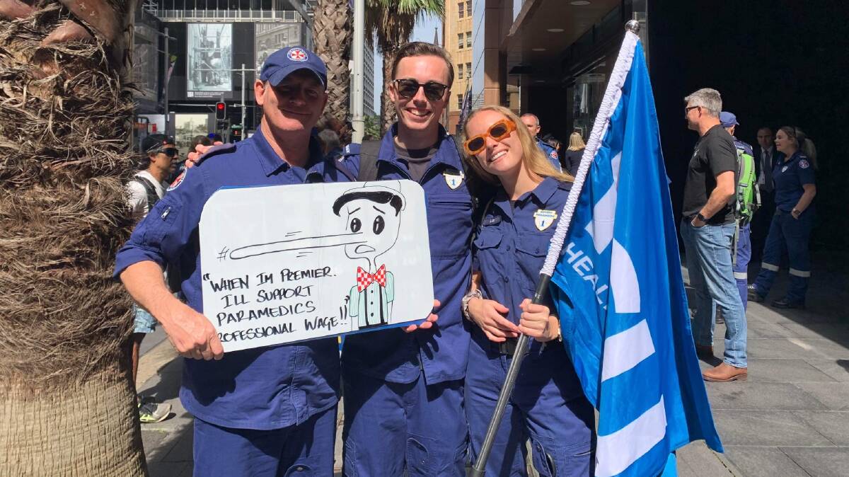 Leeton paramedic Liam Ward (left) with Matthew Brett and Lilli Knight, who have worked in Leeton in the past at the rally in Sydney on Tuesday, September 12. Picture supplied