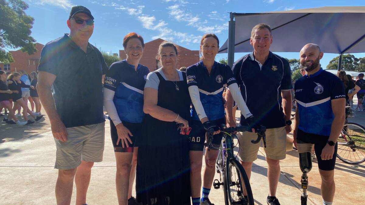 CALLING THROUGH: Riders and supporters of the PedalCure4MND visited St Francis College during their epic 900km charity bike ride last week. Photo: Talia Pattison