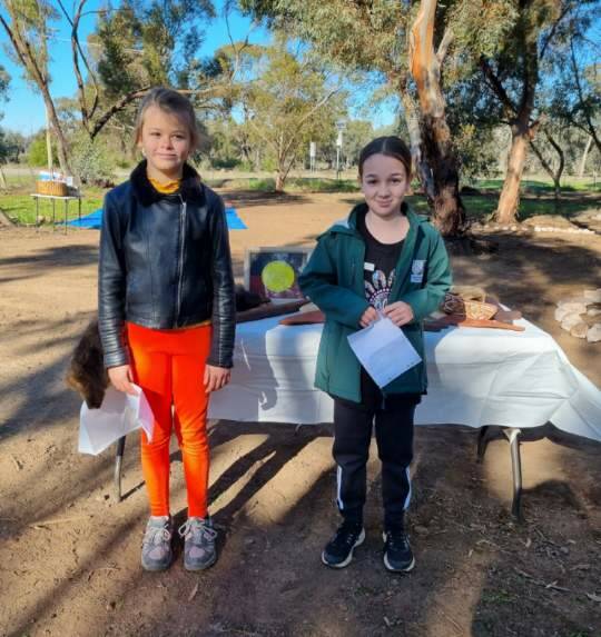 Tahnee Dowdy (left) and Eva Morriss read the acknowledgement of country in Wiradjuri language. Pictures supplied 