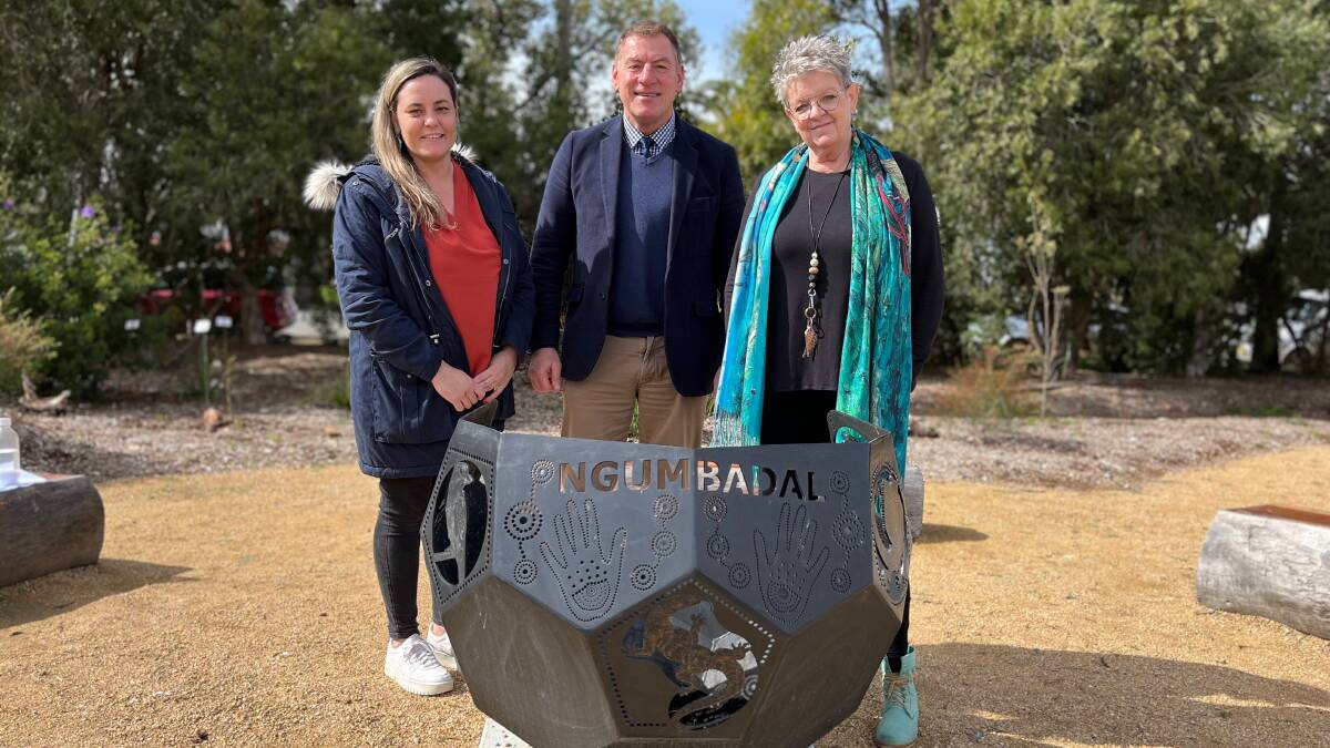 PERFECT SPOT: St Francis College staff Tinyka Tabain, Seb Spina and Janice Drew gather at the Ngumbadal fire pit. Photo: Talia Pattison