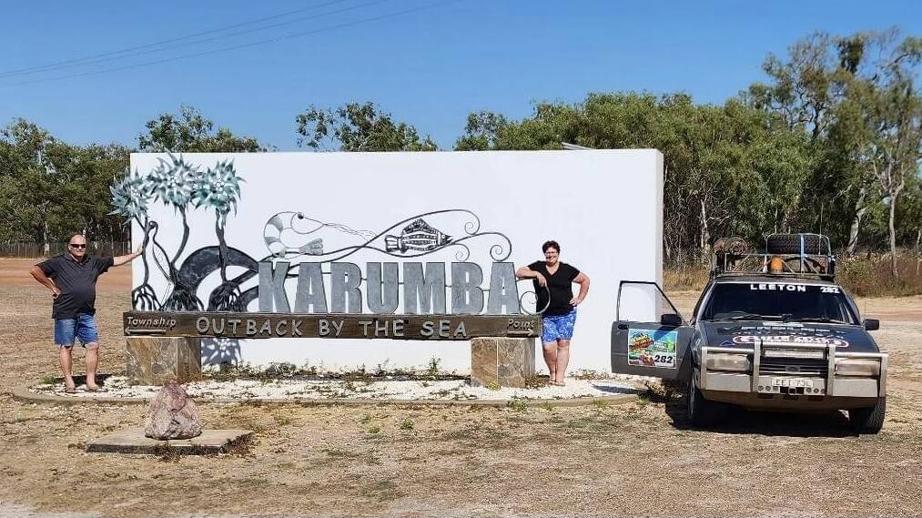 Craig and Colleen Willis at the Karumba sign "where the outback meets the sea". The town was the final destination on the rally. Picture supplied