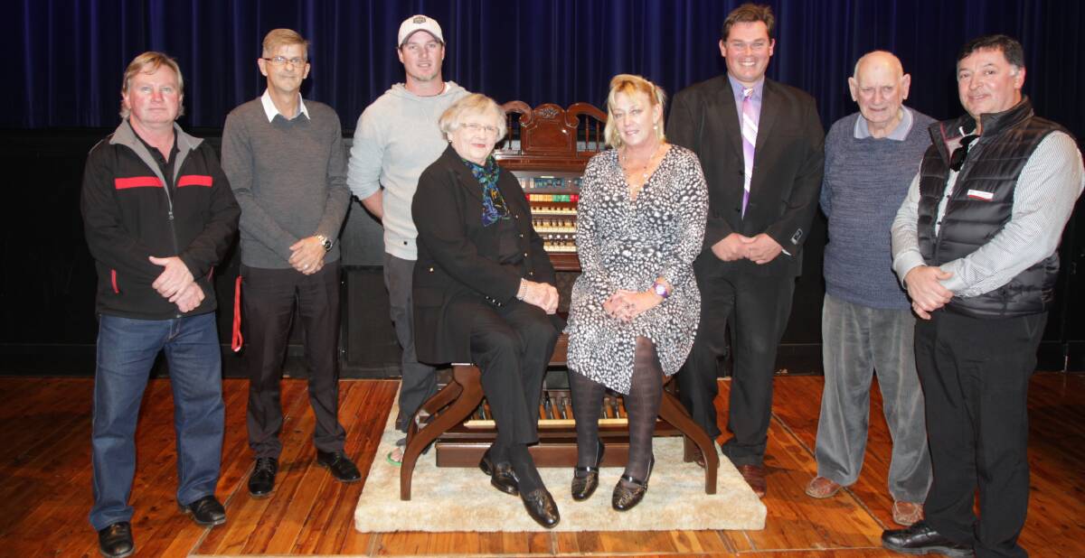 HAPPY: Tim Coulter, Graham Heffer, Rennie Simson, Margaret Sands, Robyn Simpson, Jade Salafia, Brian Aird and Clay Pasquetti with the new organ. 